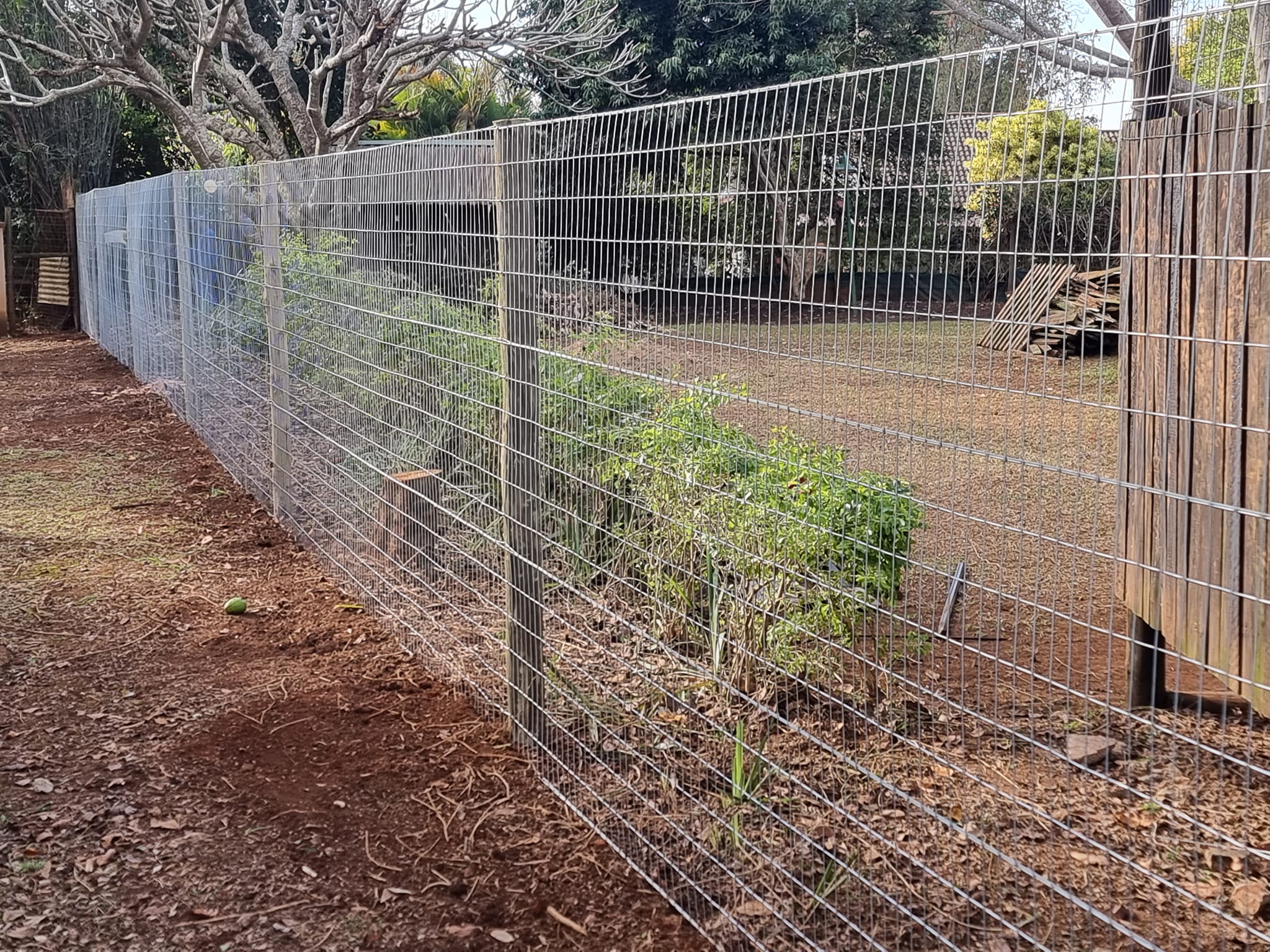 Weld mesh along factory wall